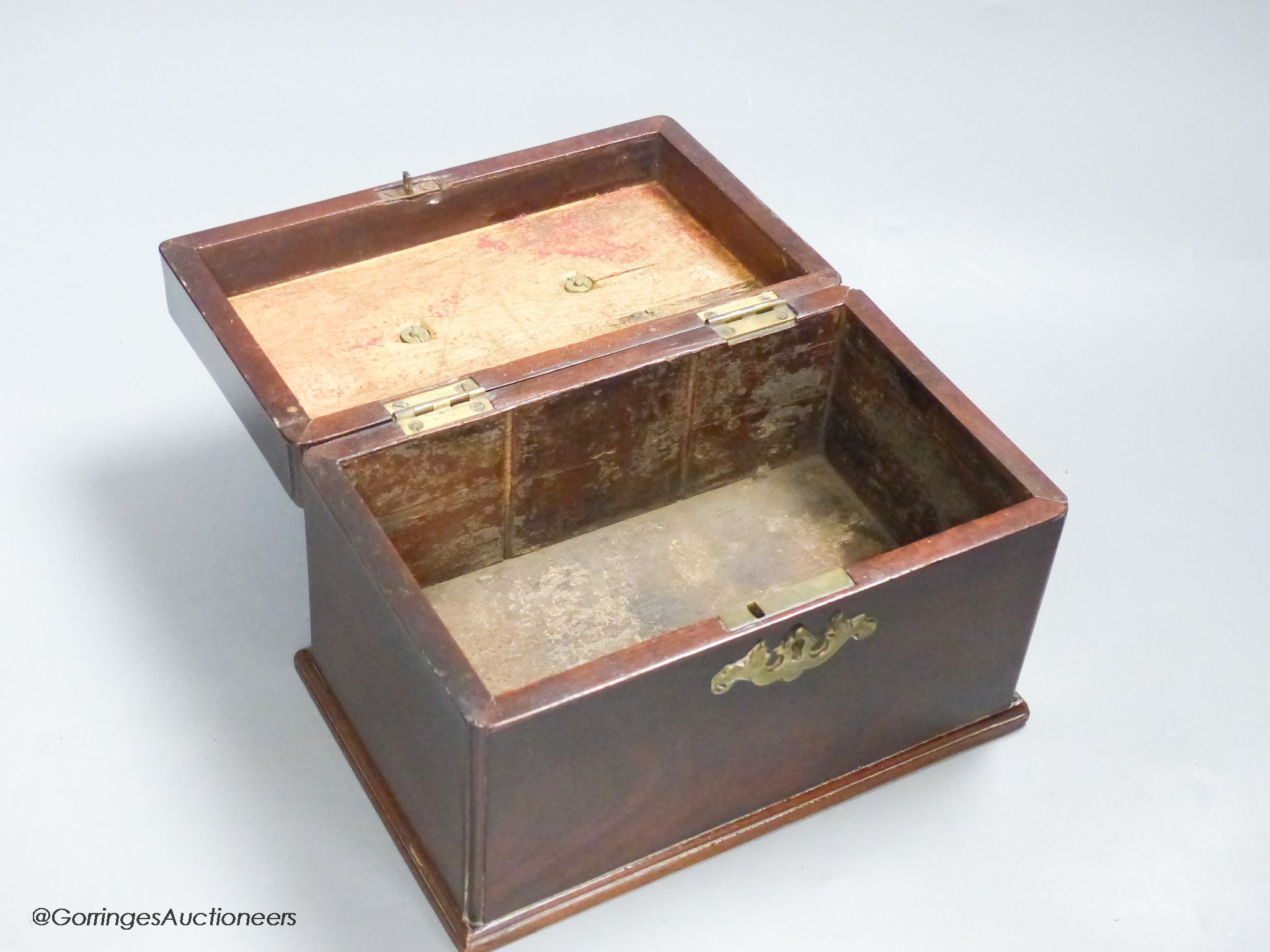 A George III mahogany tea caddy, with a concealed drawer to one end, width 22cm height 14cm